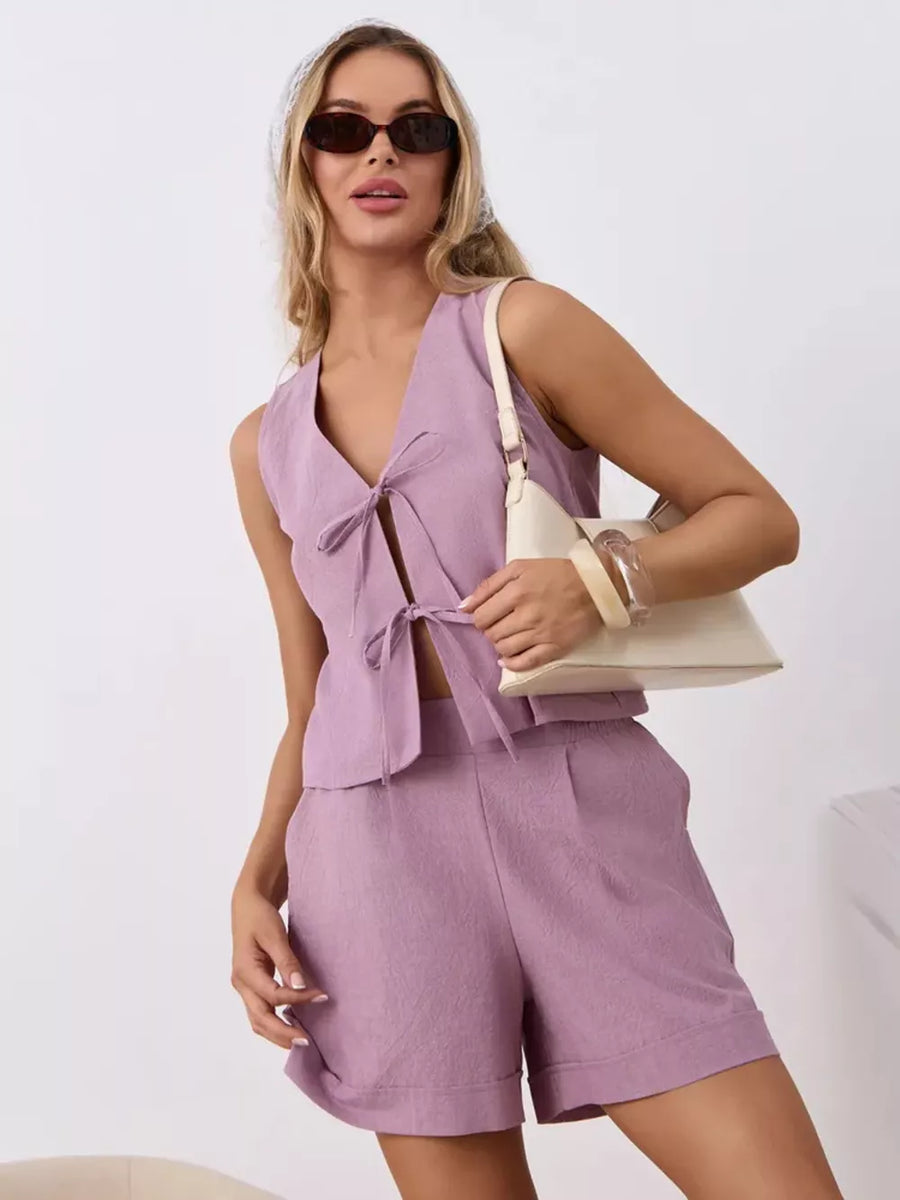 Purple cotton tie-front sleeveless top and cuffed shorts set.
