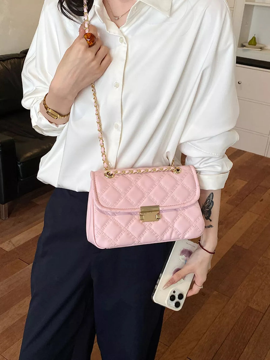 blush pink crossbody bag with turn-lock and quilted