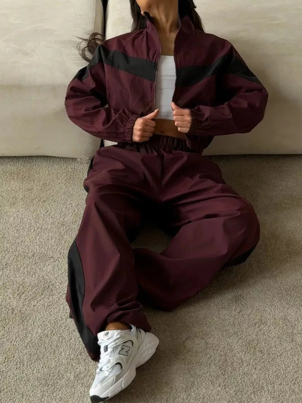 100% polyester Care instructions: Machine wash cold tracksuit set in brown with relaxed silhouette