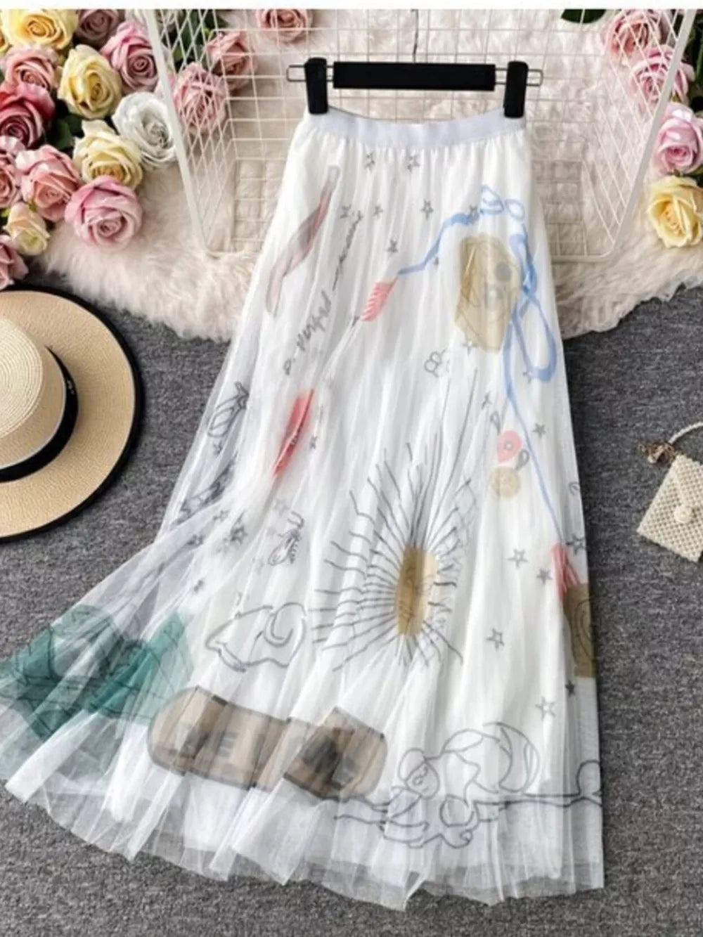 White tulle midi skirt with abstract sunburst print and pleated detail