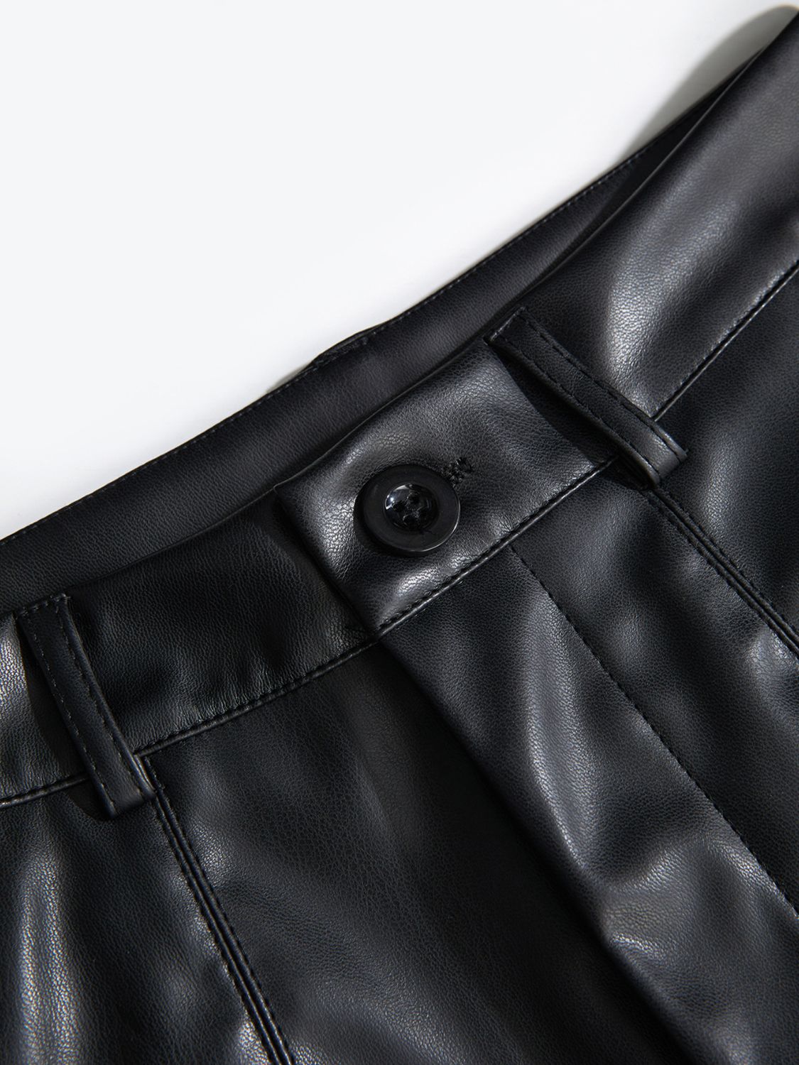 Black vegan leather bermuda shorts with button closure detail