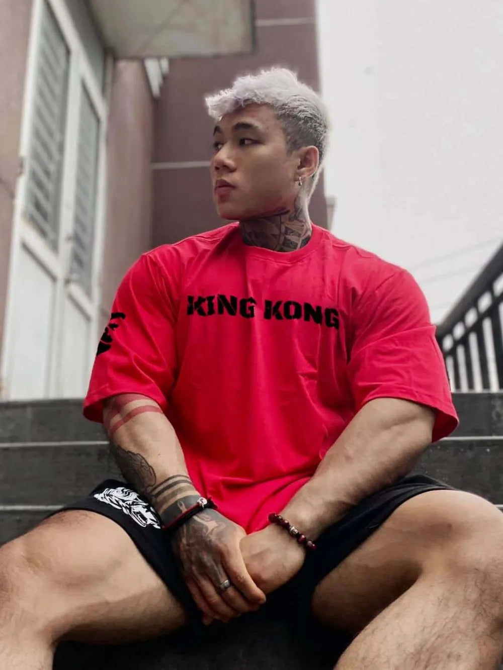 Red King Kong oversized graphic tee with bold black text and short sleeves.