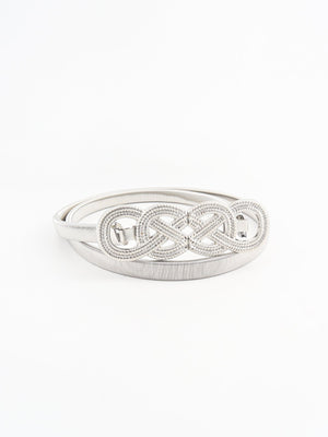 Silver elastic belt with intertwined knot detail and metal buckle