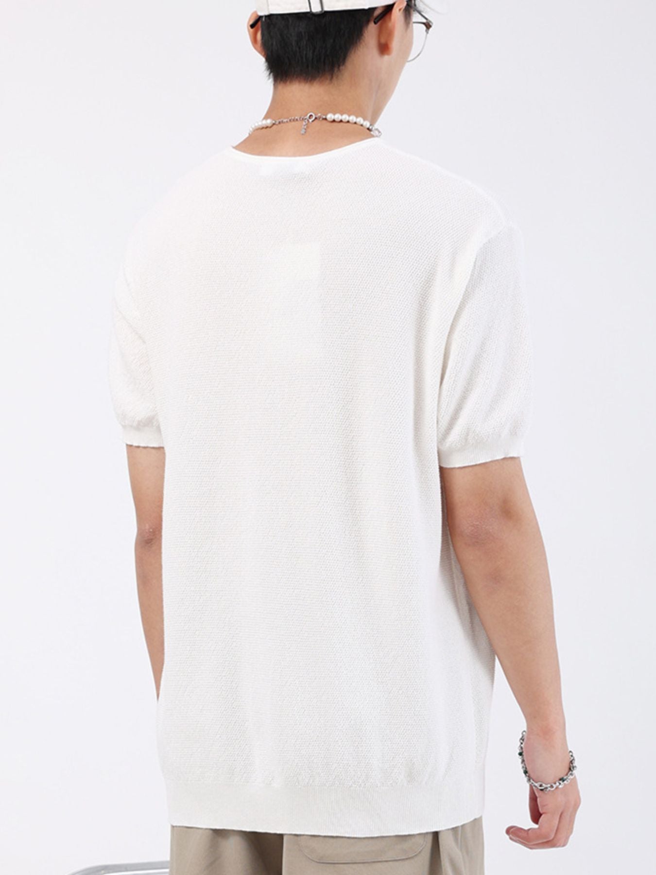 Men's white casual knit t-shirt with short sleeves and crew neck.