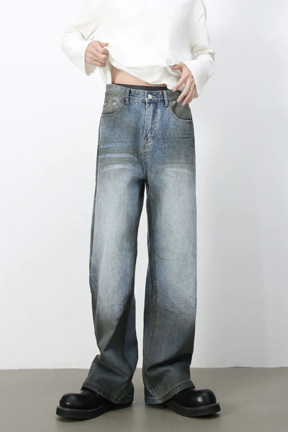 Faded gradient wide-leg jeans in medium wash denim with a relaxed fit.