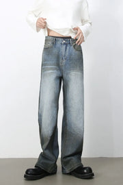Faded gradient wide-leg jeans in medium wash denim with a relaxed fit.