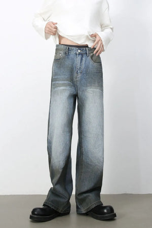 Faded gradient wide-leg jeans in medium wash denim with a relaxed fit.
