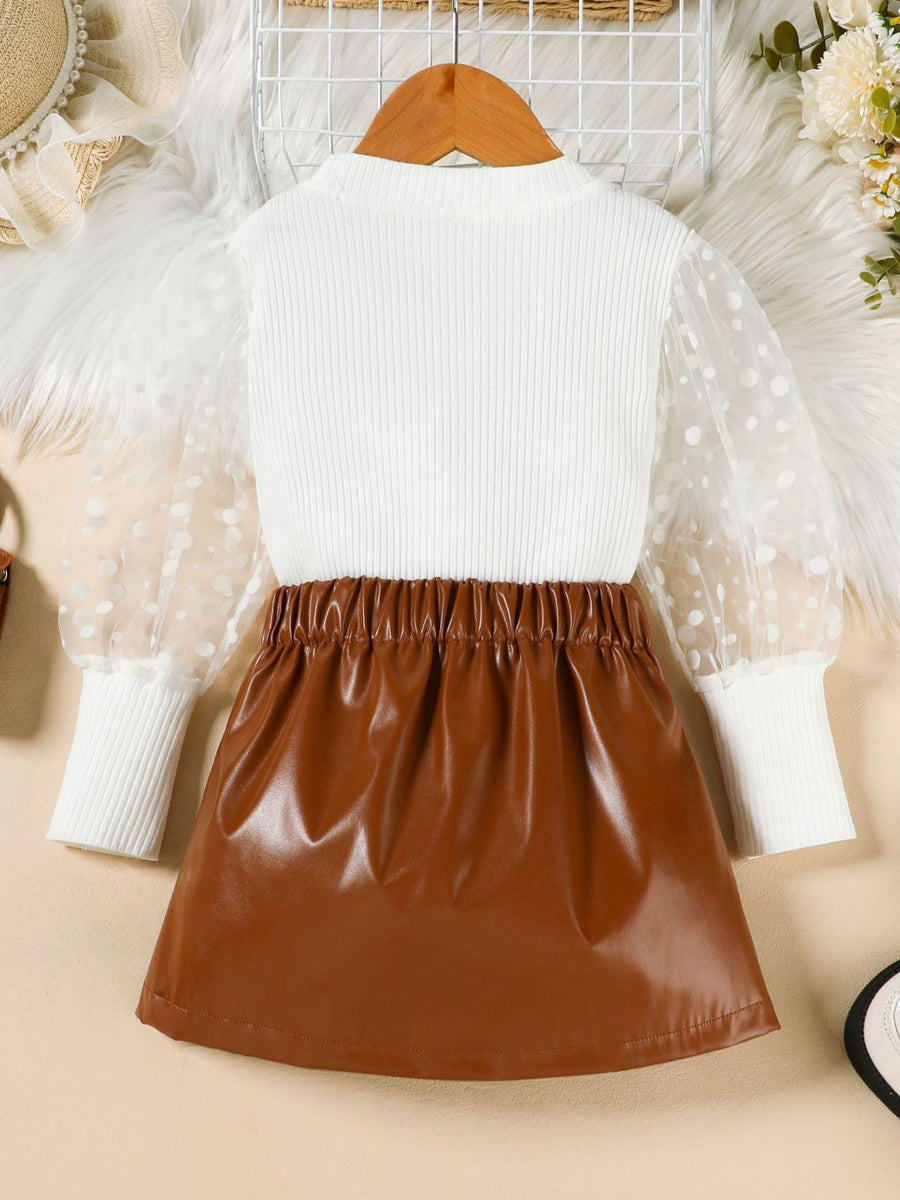 White polka dot sleeve top and brown faux leather skirt set for toddlers.