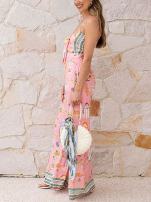 Pink architectural print tie-front wide-leg jumpsuit with bow detail and wide legs.