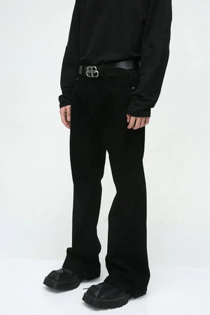 Dark denim bootcut trousers with a classic fit and a black belt.