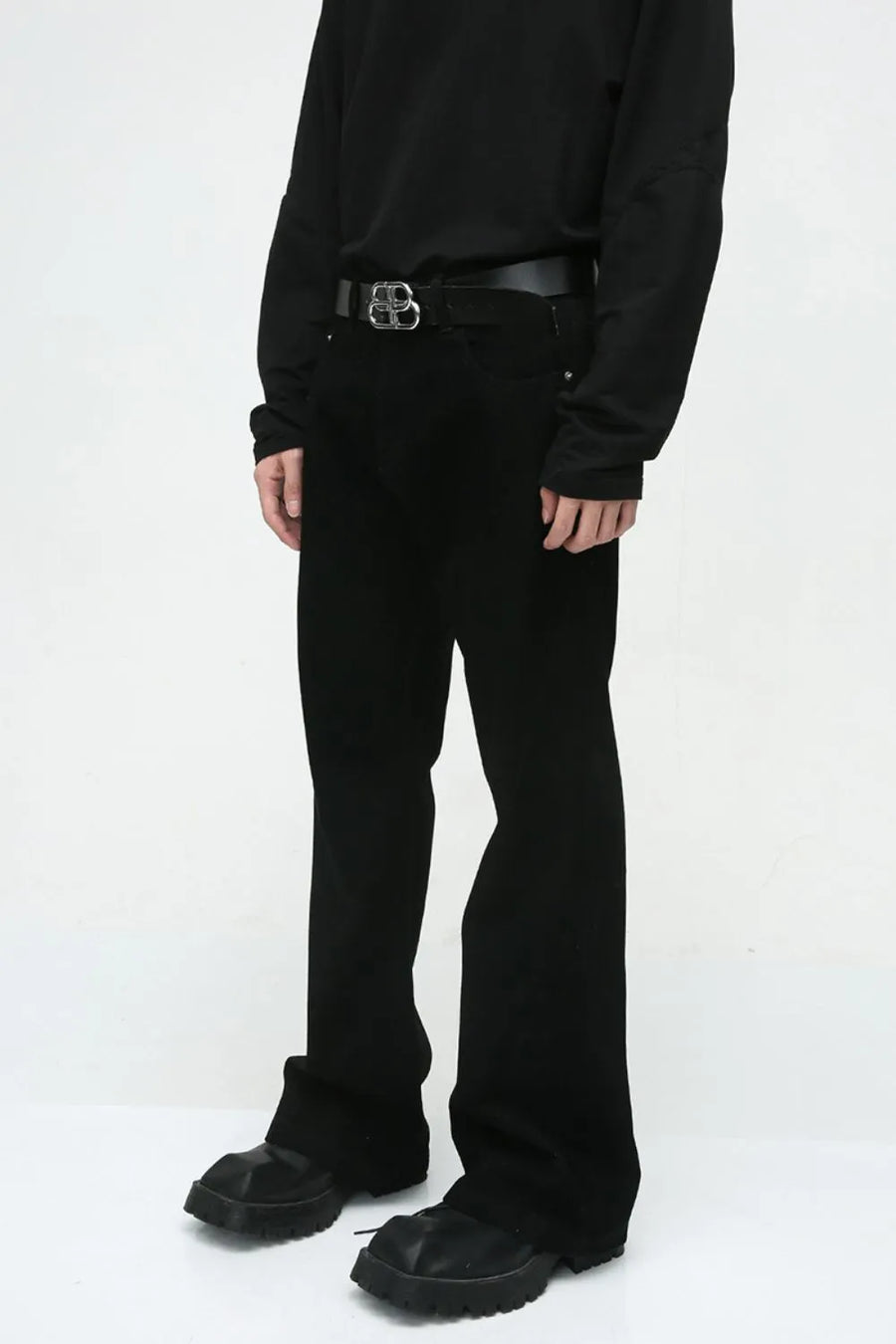 Dark denim bootcut trousers with a classic fit and a black belt.