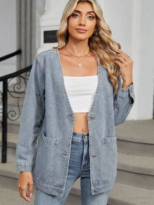 Light blue denim blazer with button front and patch pockets, open neckline.