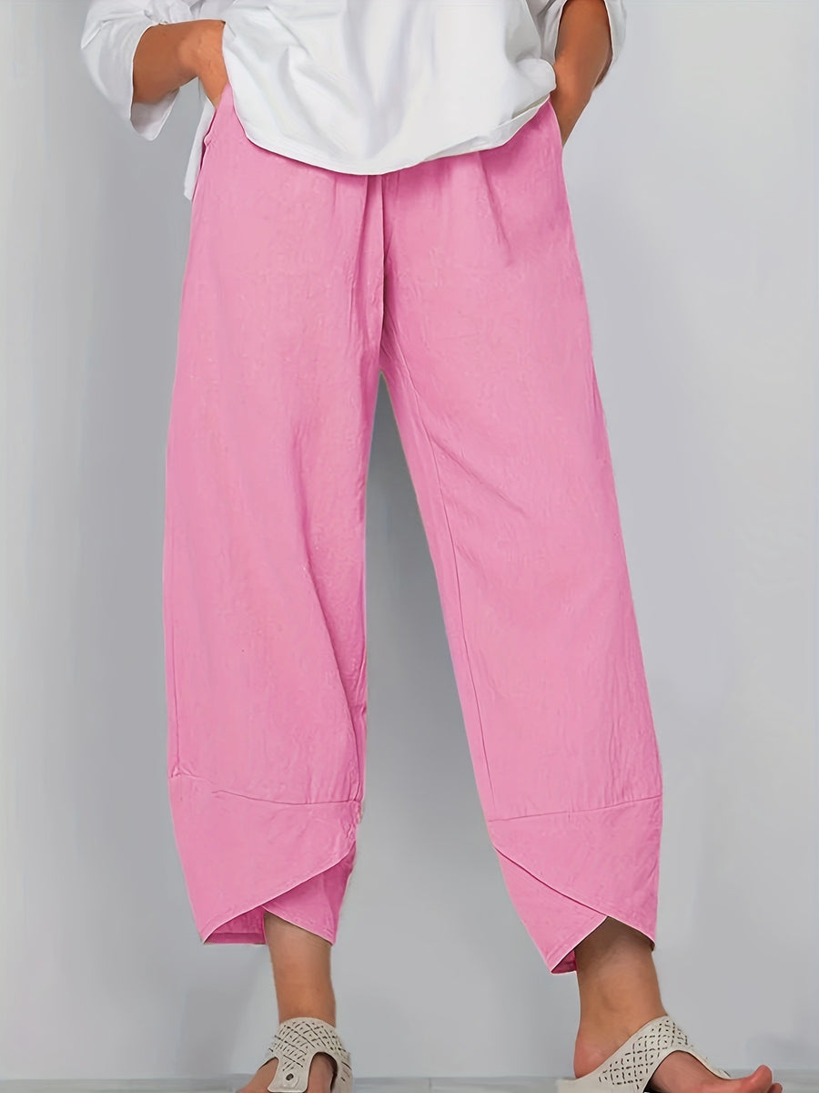 Relaxed fit wide-leg pants in bright powder with pockets and asymmetrical hem detail.