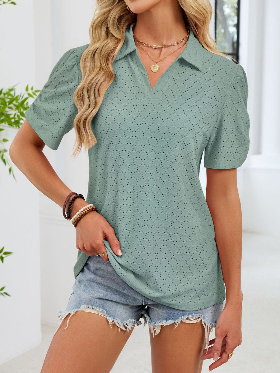 Sage eyelet ruched short sleeve blouse with a collared neckline.
