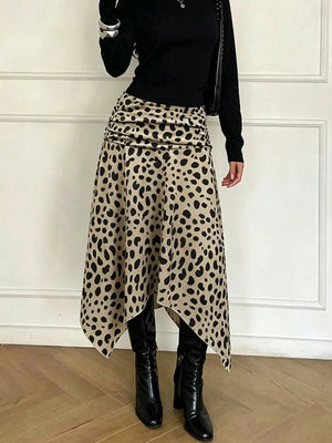 Leopard print midi skirt with asymmetrical hem and ruched detail.