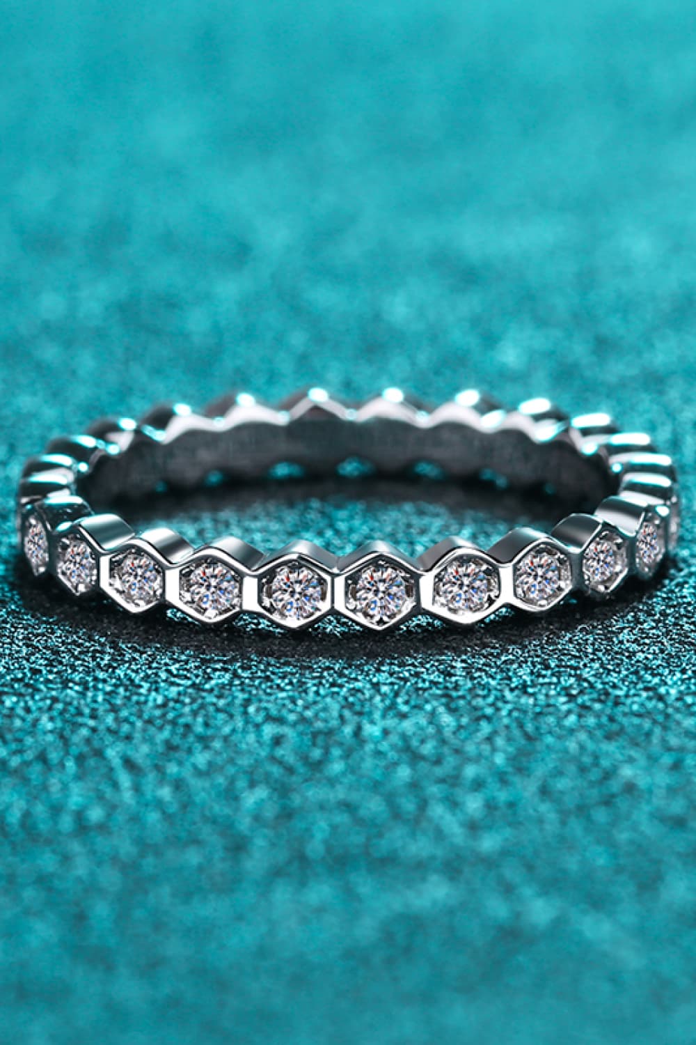 Silver eternity ring with hexagonal settings and clear stones