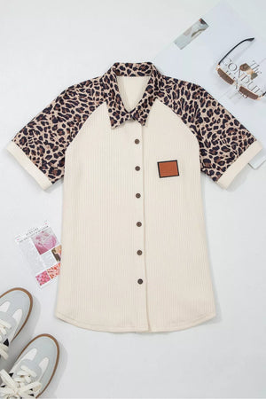Ribbed cream button-down shirt with leopard print raglan sleeves and collar.