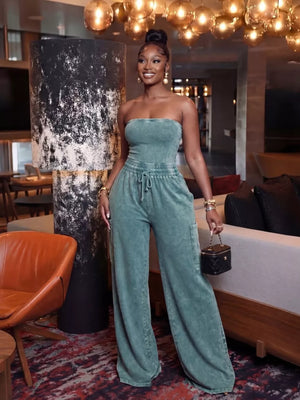Teal washed cotton strapless jumpsuit with drawstring waist and wide legs.
