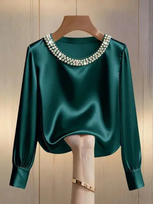 Green satin blouse with pearl trim round neck and long sleeves