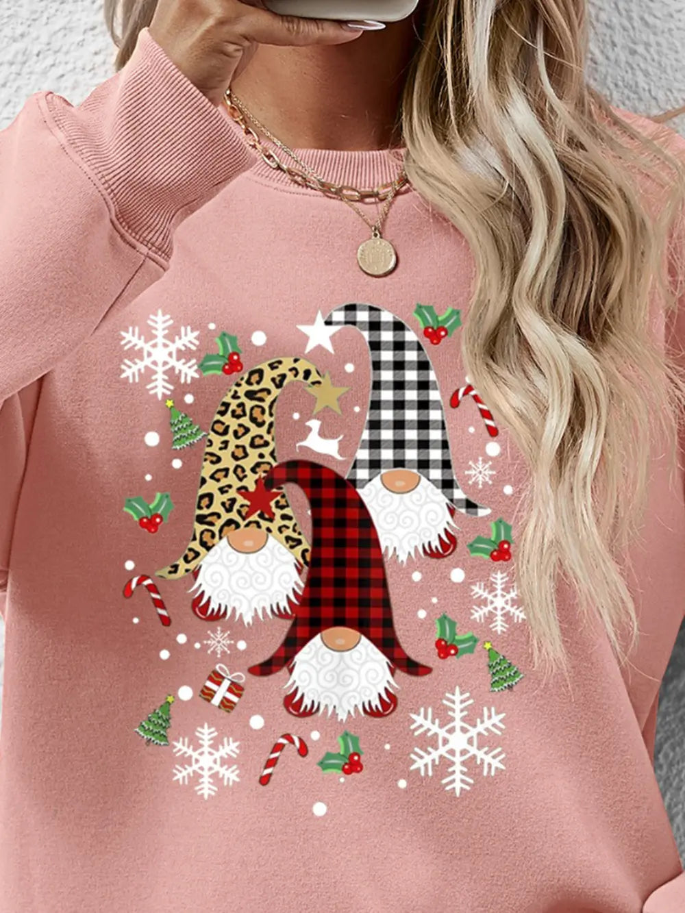 Blush pink raglan sweatshirt with festive gnome graphic, snowflakes, and candy canes.