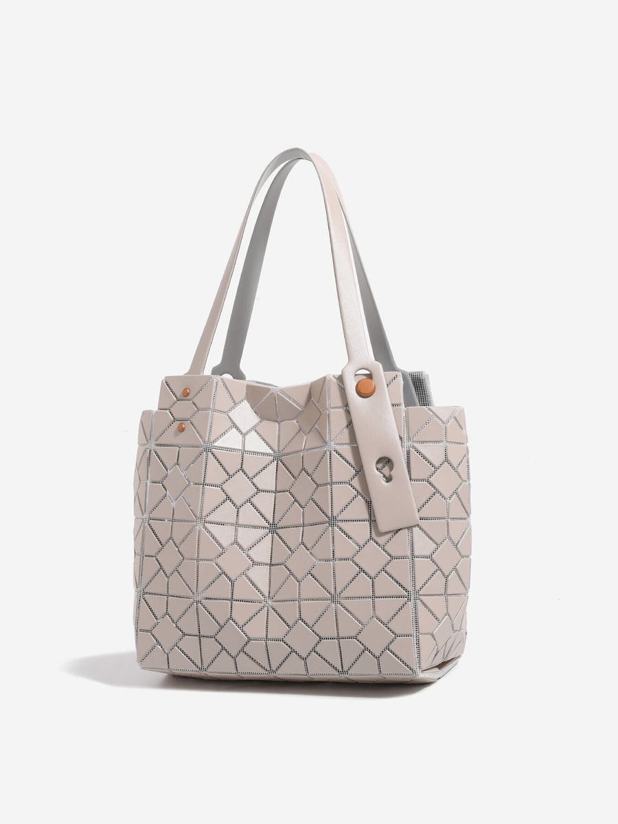 Pink handbag featuring structured and geometric