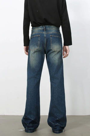 Faded wash dark flare jeans with a casual, bootcut style.