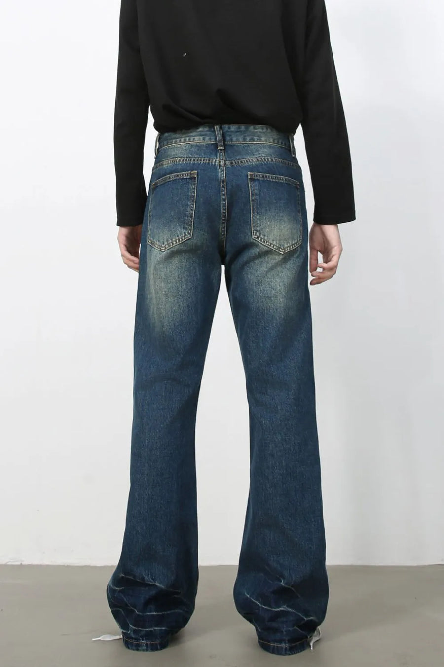 Faded wash dark flare jeans with a casual, bootcut style.