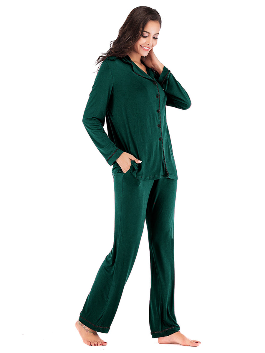 Green piped trim pajama set with pockets, long sleeve button-up top and pants.