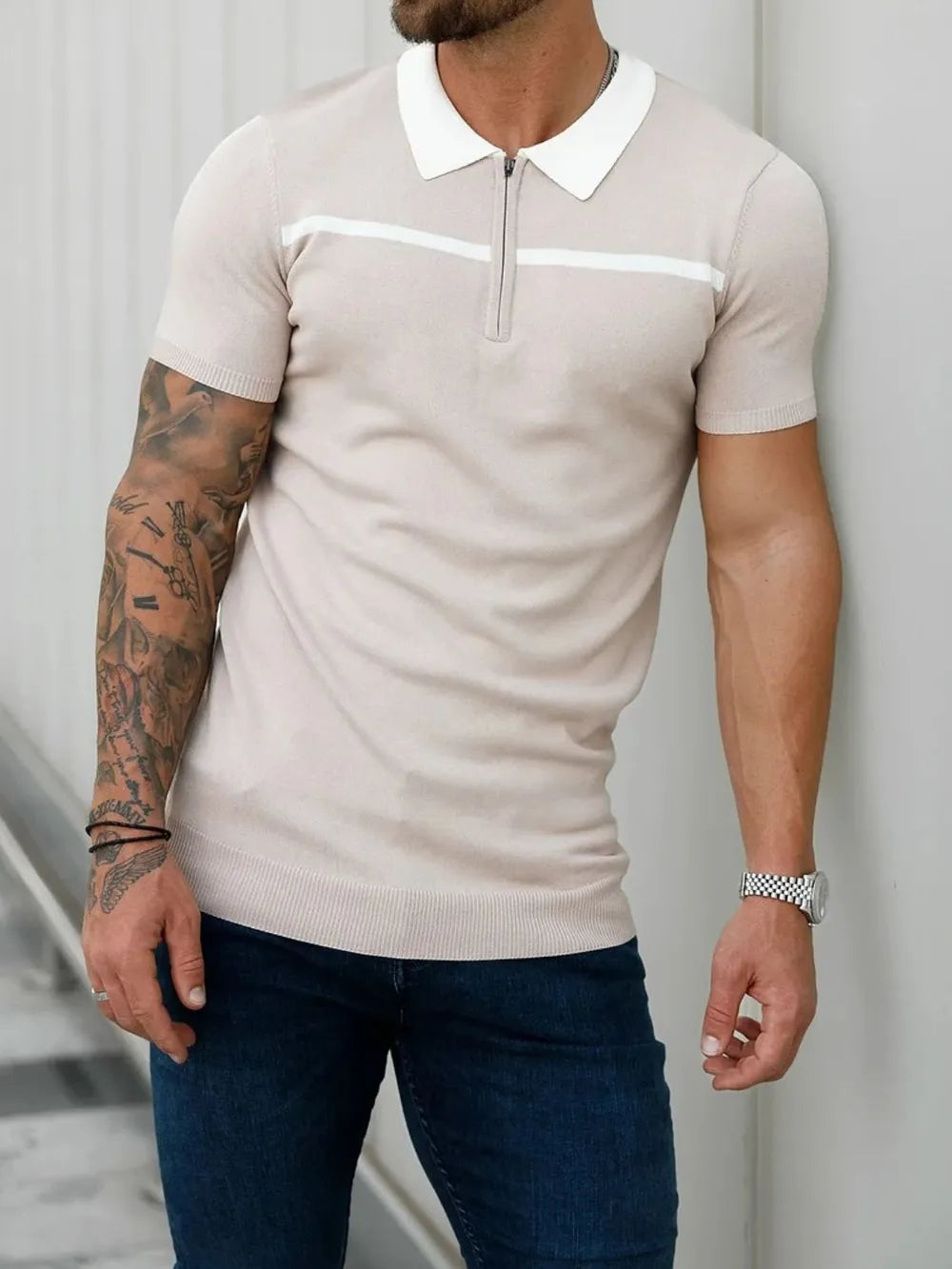 Dust Storm knit polo with zip neck, white contrast trim and collar.