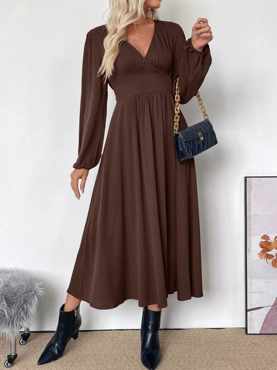 Brown V-neck midi dress with puff sleeves and A-line skirt.