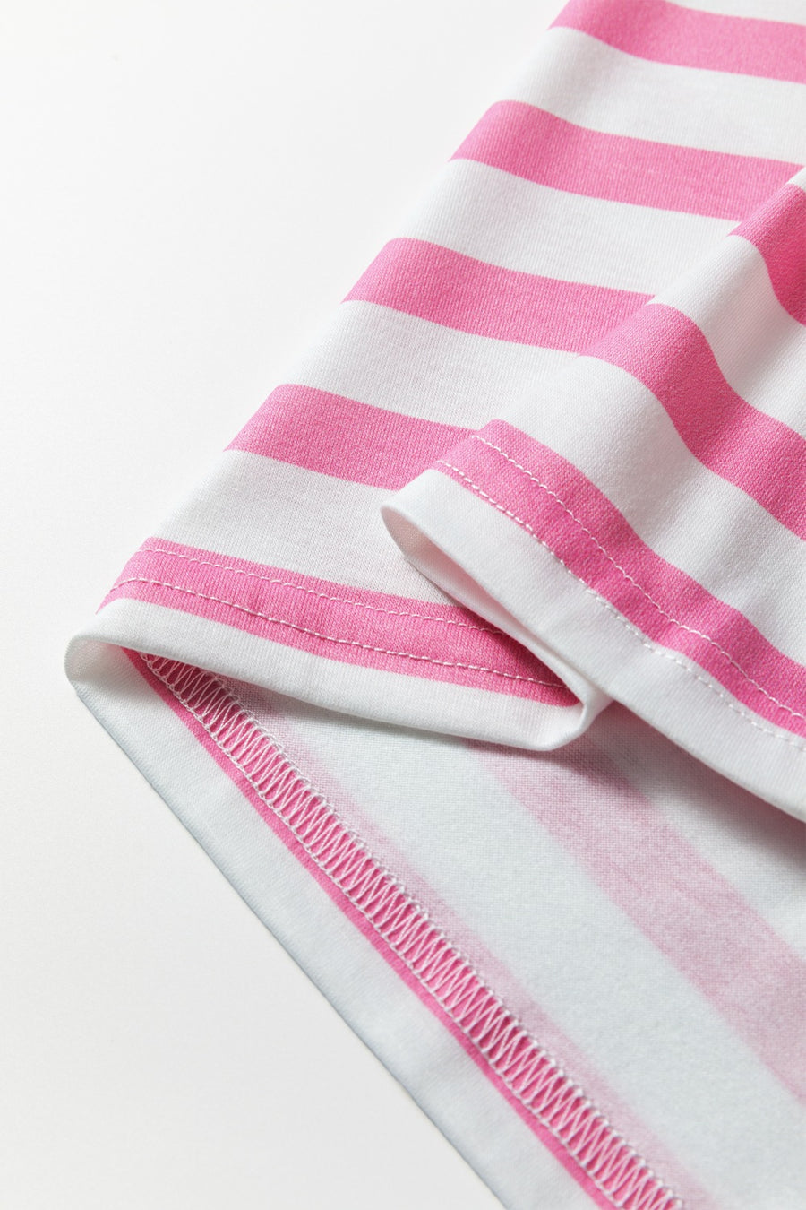 Striped V-neck t-shirt in blush pink and white with visible stitching details.