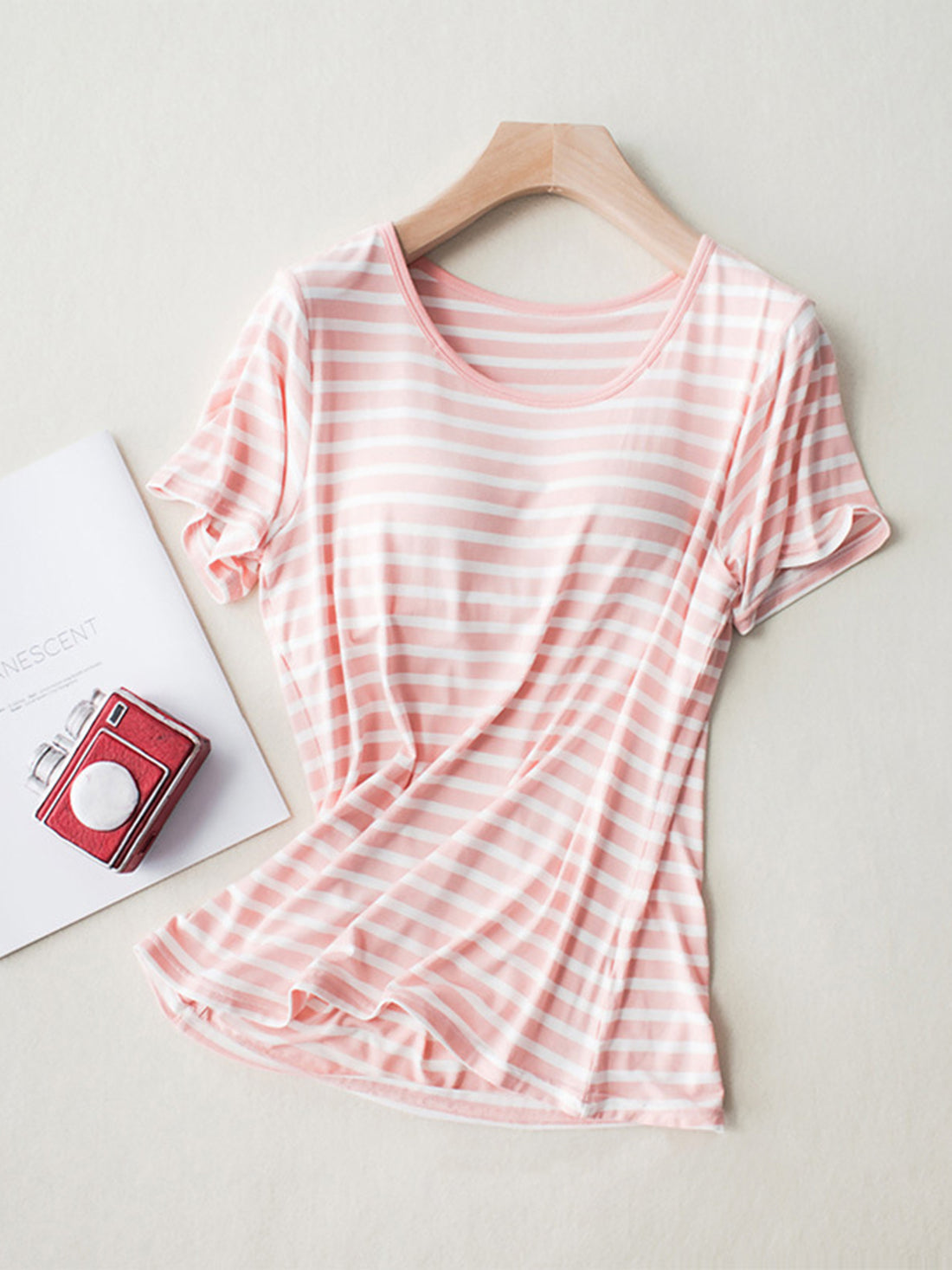 Pale blush and white striped built-in bra tee with a scoop neck and short sleeves.