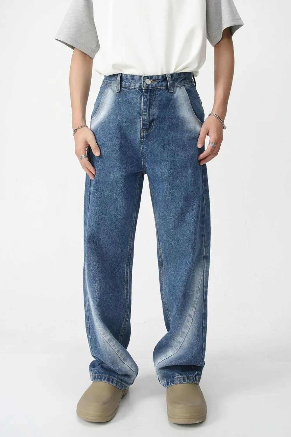 Faded panel wide-leg jeans in medium wash denim with a relaxed fit.