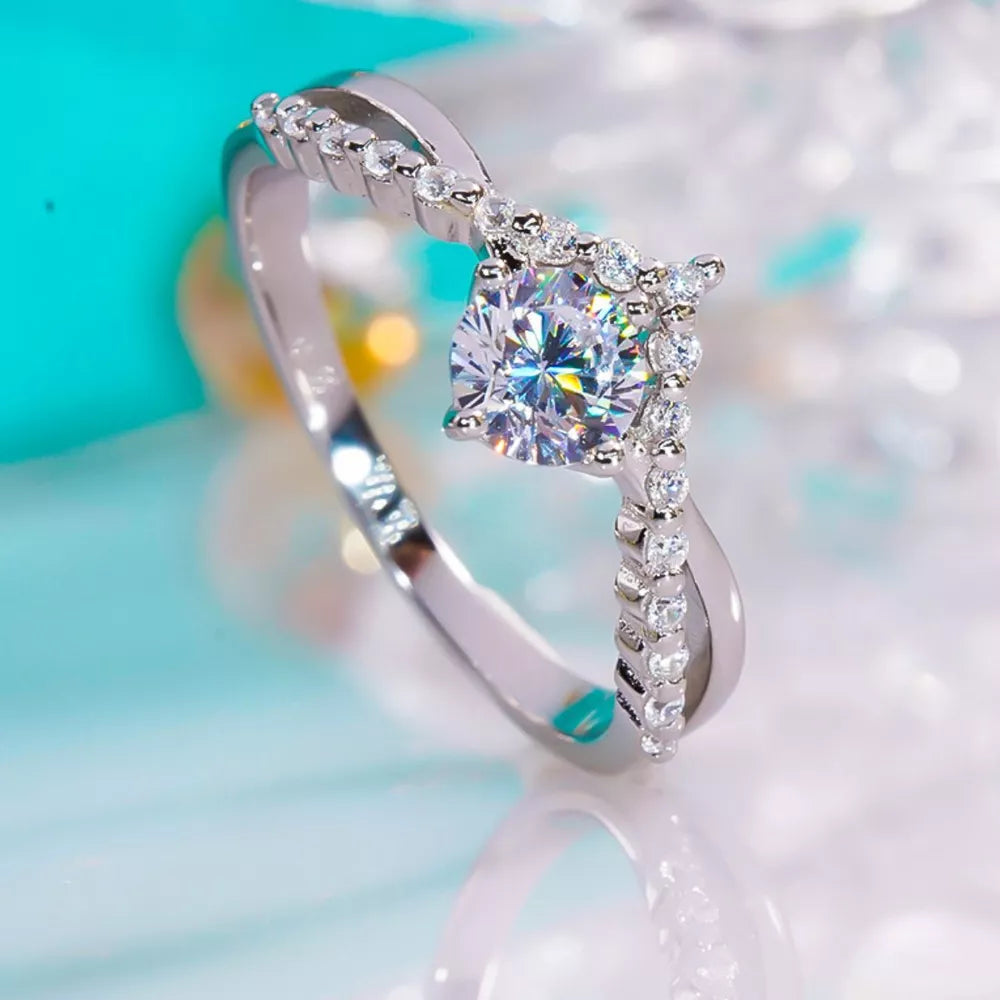 925 sterling silver,Moissanite Care instructions: Avoid wearing during exercise, ring in clear with V-shape silhouette