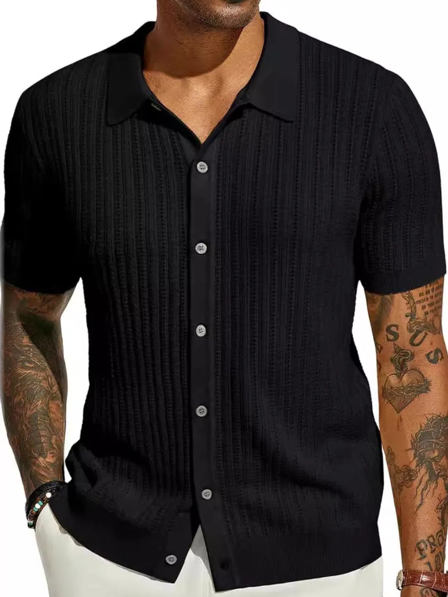 Black textured knit polo shirt with openwork detail and button placket.