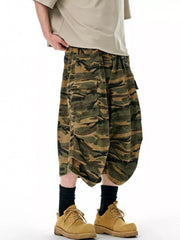 Oversized cotton camo cargo shorts in olive brown with multiple pockets and a relaxed fit.