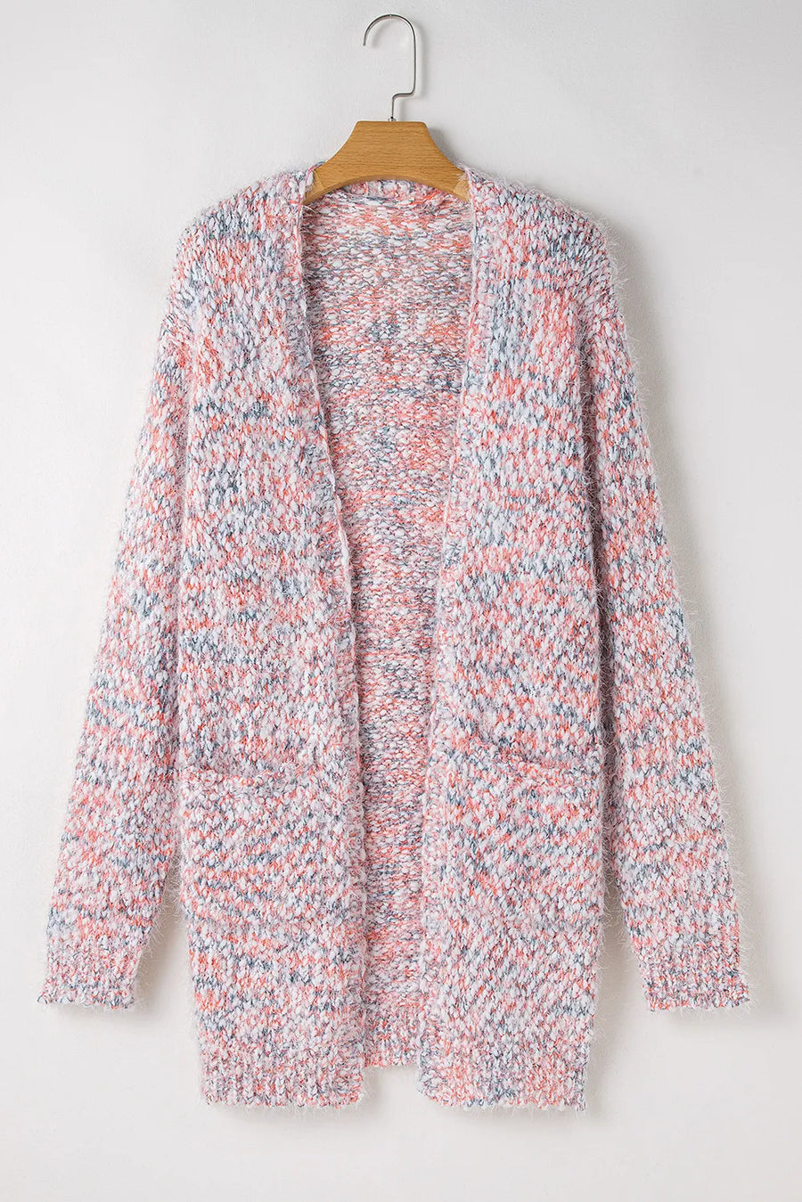 Multicolor bouclé knit cardigan with pockets and open front, featuring blush pink, grey, and white flecks.