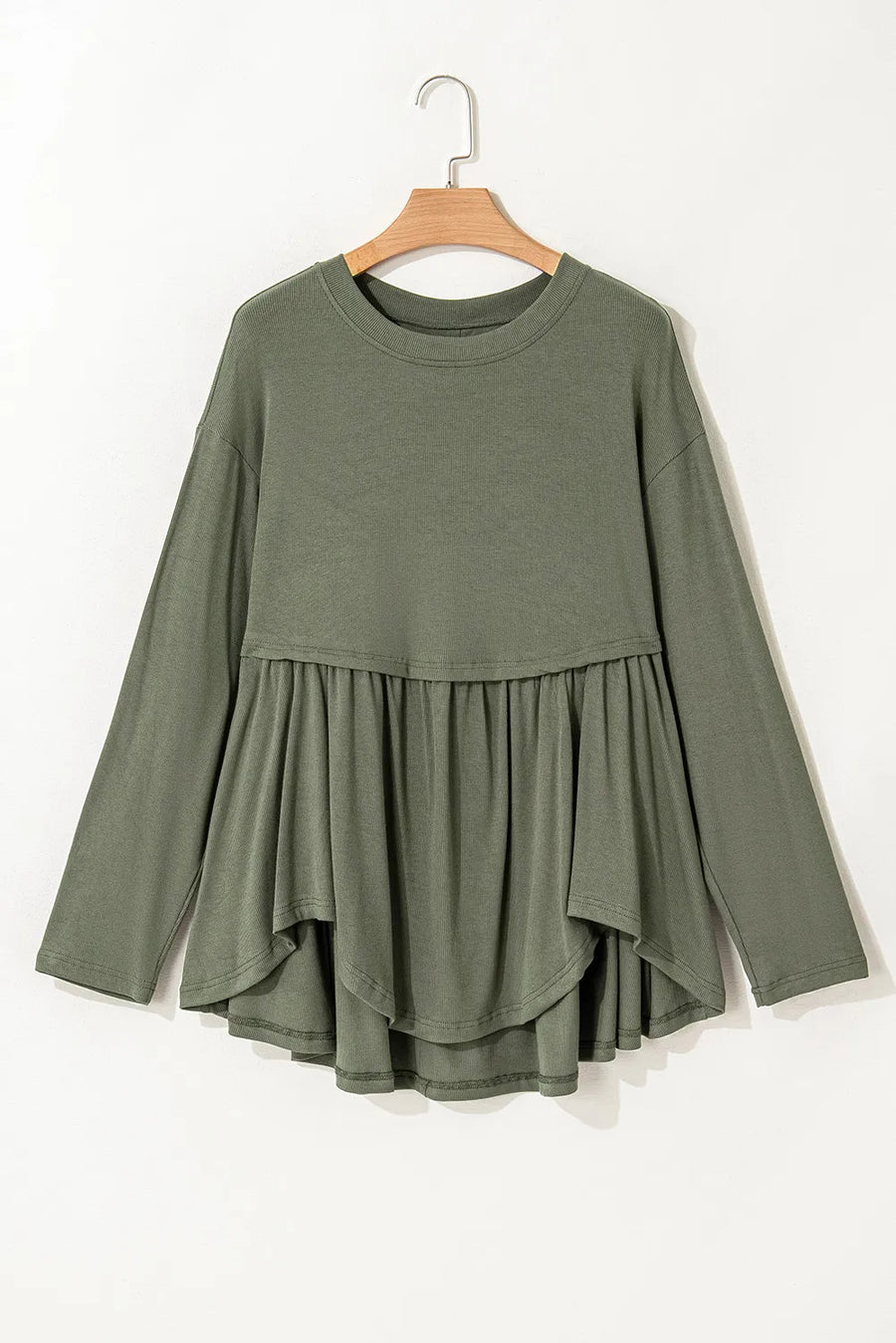 Moss ribbed peplum blouse with long sleeves and tiered ruffled hem