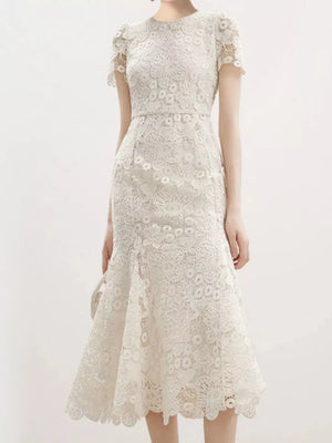 Cream floral lace mermaid evening gown with cap sleeves and scalloped hem.
