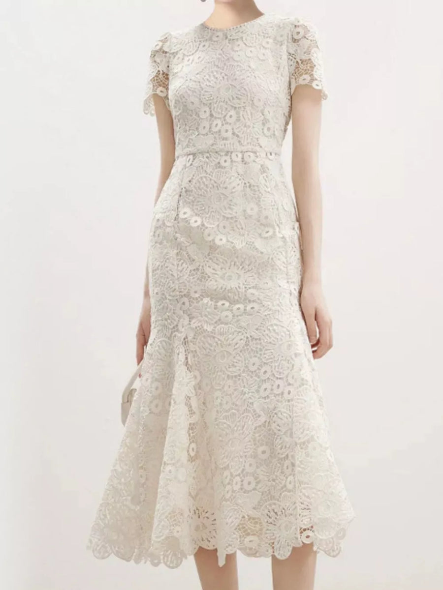 Cream floral lace mermaid evening gown with cap sleeves and scalloped hem.