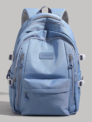Large blue nylon backpack with multiple zippered pockets and adjustable straps.