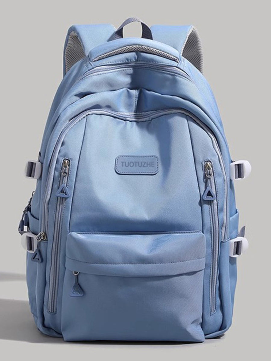 Large blue nylon backpack with multiple zippered pockets and adjustable straps.