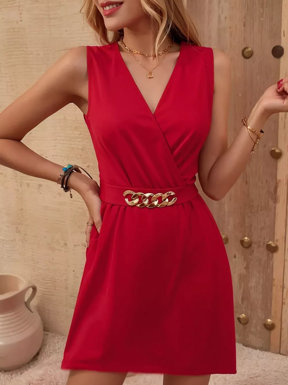 Red V-neck mini dress with gold chain belt