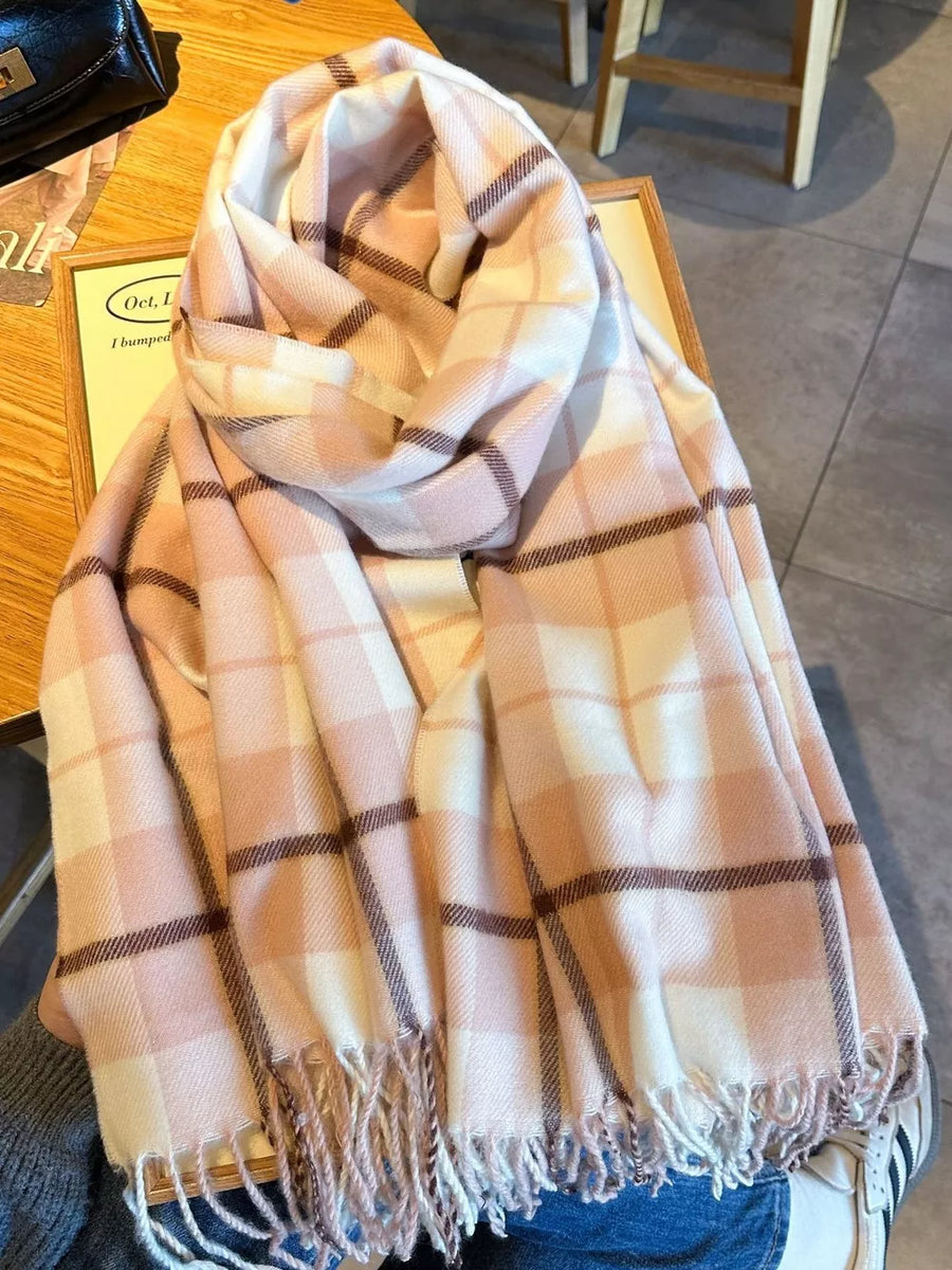 Plaid fringe scarf in pink and cream with dark brown accents.
