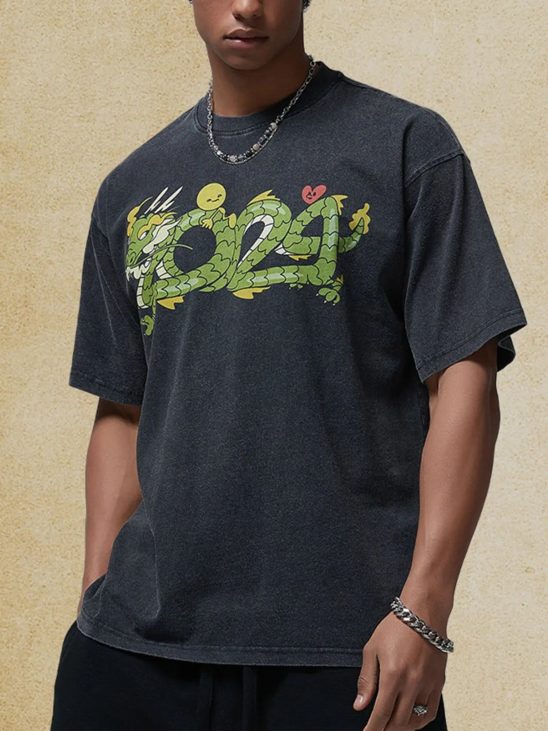 Black washed cotton tee with a bold green dragon graphic and a crew neck.