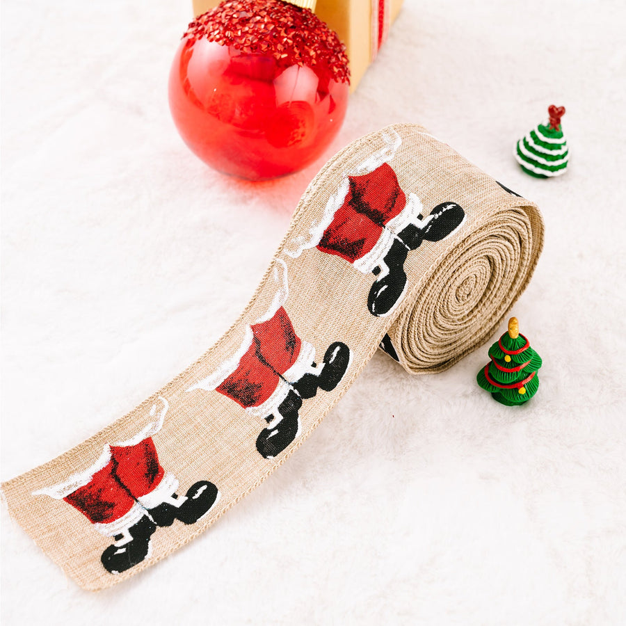 Burlap ribbon with Santa legs pattern, beige, for holiday crafts.