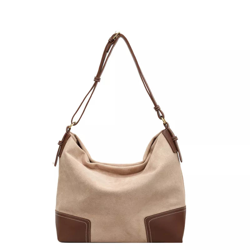 Elegant suede tote bag in khaki with brown leather accents and adjustable strap.