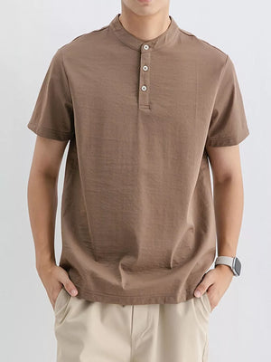 Brown cotton henley t-shirt with short sleeves and button placket.