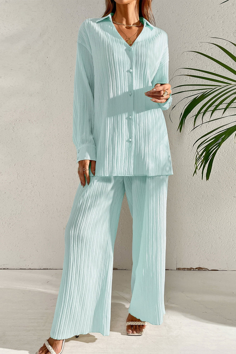 Pastel blue pleated co-ord set with button-down shirt and wide leg trousers