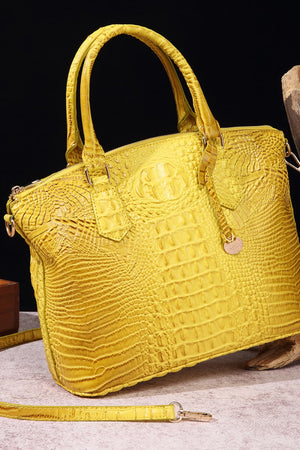 Yellow crocodile embossed satchel bag with top handles and shoulder strap